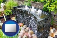 colorado map icon and bubbling water feature in a landscape