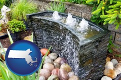 massachusetts map icon and bubbling water feature in a landscape