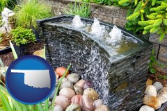 oklahoma map icon and bubbling water feature in a landscape