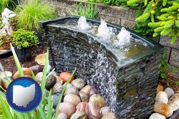 bubbling water feature in a landscape - with Ohio icon